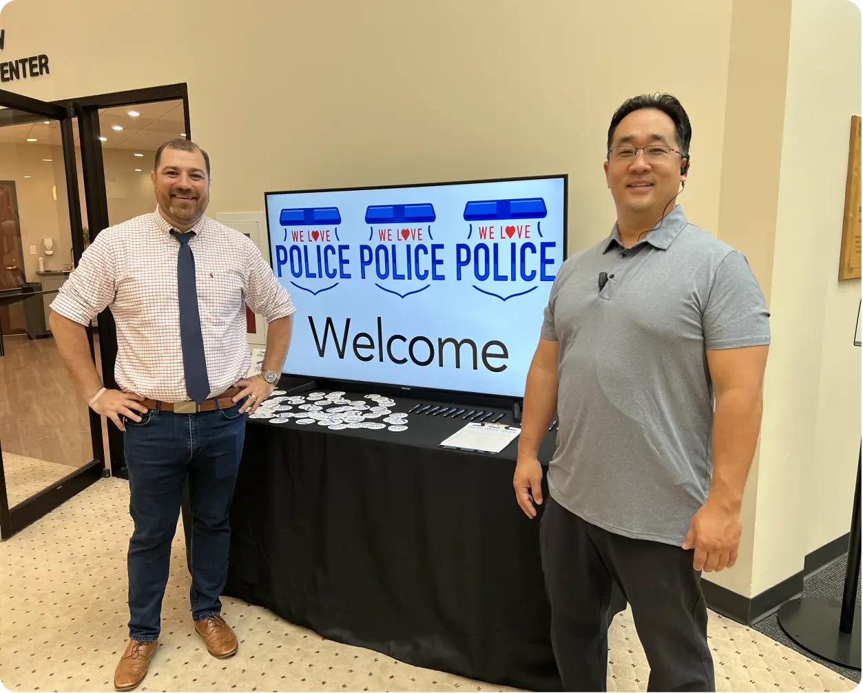 Church members welcoming attendees at police support event, community outreach idea for churches