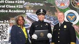 Officer Brianna Williams of the Atlanta Police Department smiles at her police academy graduation ceremony