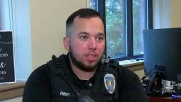 Anniston Police Department Officer Jeffrey Finley sitting at his desk in uniform.