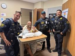Patient Antonio Gilmore expresses gratitude to responding airport police services deputies inside a local hospital room.