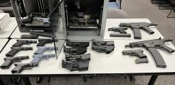 Close up display of illegal firearms and untraceable ghost guns seized by the Santa Clara County Gun Violence Task Force.
