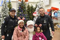 Lansing police department officers with Santa and kids.