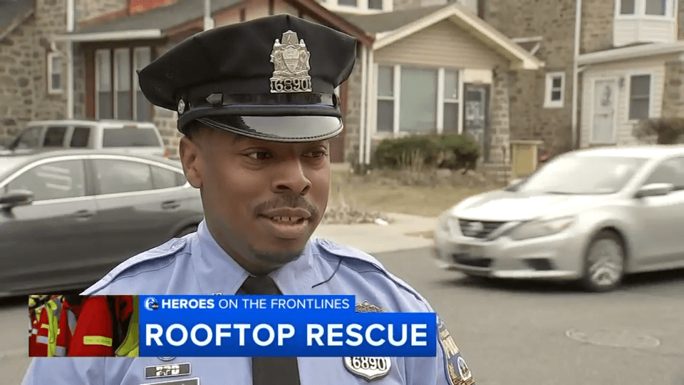 Philadelphia police officer after rescuing 5-year-old from rooftop in a heroic moment