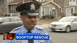 Philadelphia police officer after rescuing 5-year-old from rooftop in a heroic moment