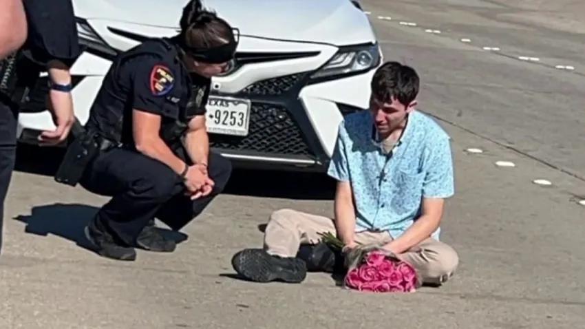 Plano Police Officer Rust kneeling beside teen holding flowers after Easter Sunday crash