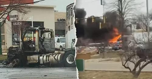 Thick black smoke and bright orange flames rising from a highway accident in Michigan.