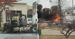 Thick black smoke and bright orange flames rising from a highway accident in Michigan.