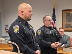 Officers John Mosora and Chuck Lohry receiving a life saving award from the Cortland Police Department.