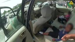 Cobb County Police bodycam view of two young children being rescued from a hot car.
