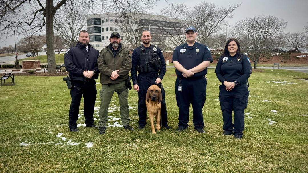 Gastonia NC police officers and K-9 Bo standing in the snow after a successful rescue mission.
