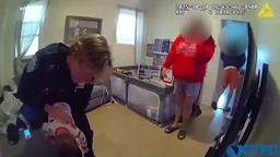 NYPD 115th Precinct officer providing emergency medical aid to a 10-month-old boy.