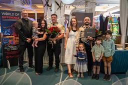 LVMPD Officers Austin Shupe and Jacob Bowden stand with their families after receiving a community service award in Las Vegas.