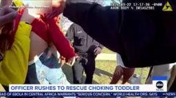 Philadelphia police sergeant performing emergency care on a toddler at a local park.