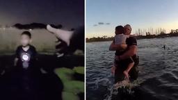 Volusia Sheriff’s Office deputy carrying a young boy out of a Deltona Florida pond.