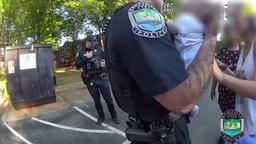 A Knoxville Police Department officer holding a baby during an emergency response as recorded on a body-worn camera.