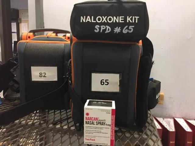 Springfield Police Department logo with life-saving Narcan nasal spray kits.