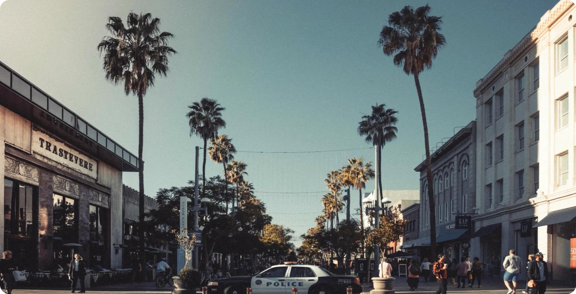 Police car patrolling a peaceful city street, symbolizing the duties and responsibilities of police officers in America