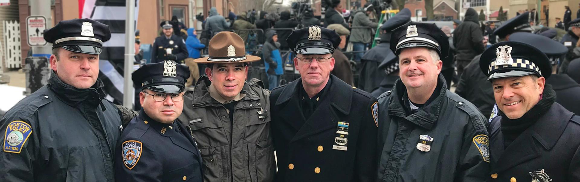 Police officers standing together during a public event showing solidarity and positive police presence